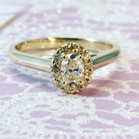 oval diamond halo engagement ring omori diamonds winnipeg