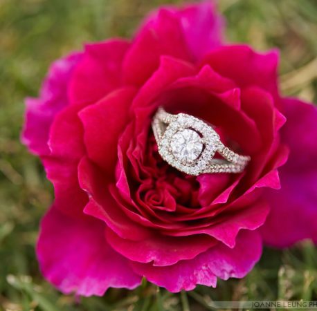 halo engagement ring on flower
